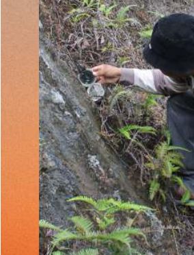 Geologist recording field observations during an engineering geological mapping survey